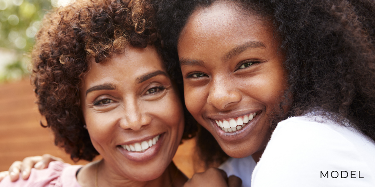 Two female models for dental implants.